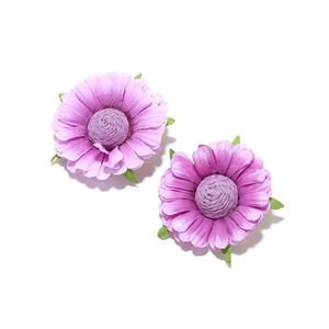 Detailed close-up of handmade purple fabric daisy flower earrings with layered petals