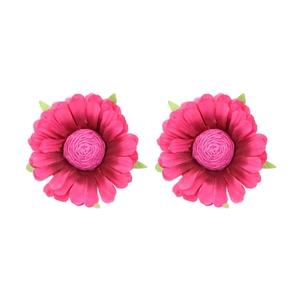 Pair of bright fuchsia fabric flower earrings with green leaves on white background