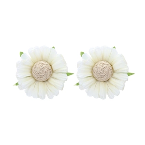 Macro shot of ivory fabric daisy earrings with cream woven centers and green leaves