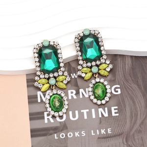 Vintage palace style long earrings with emerald green gemstones and sparkling crystals