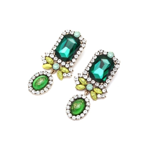Vintage court style drop earrings with green faceted emerald stones and gold alloy setting