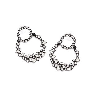 Detail of interlocking black metal hoops encrusted with clear rhinestones and crystals