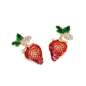 Detail of red enamel strawberry earrings with sparkling rhinestones and green leaves