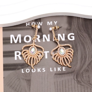 Elegant gold feather drop earrings with faux pearls and sparkling crystal accents