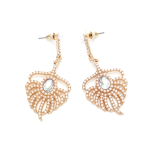 Detailed view of gold feather earrings with faux pearls and iridescent center stone