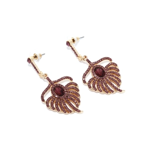 Detailed macro view of purple gemstone earrings with elegant crystal feather design