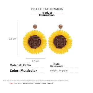 Detailed view of handmade raffia sunflower earrings with size and material specifications