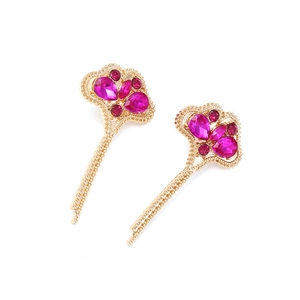 Elegant gold-tone leaf earrings with vibrant magenta rhinestones and long chain tassels
