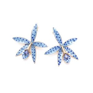 Detail of blue enamel floral stud earrings with purple crystals and spotted orchid petals