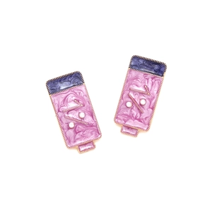 Detail of purple marble enamel earrings with gold edges and white pearl accents