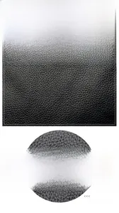 Close-up of black lychee grain leather texture with embossed kangaroo logo detail