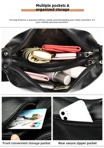 Detail of multi-pocket interior storage and pebble grain leather on black shoulder bag