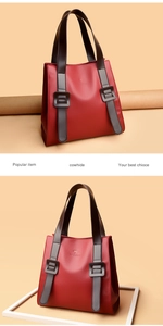 Detail of wine red lychee grain cowhide leather tote with adjustable shoulder strap