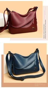 Close-up of pebble leather crossbody bags with gold logo in burgundy and navy colors