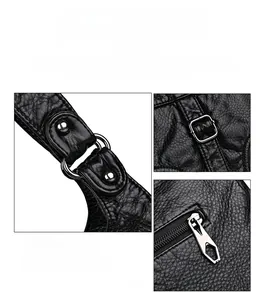 Close-up of black PVC shoulder bag with silver metal rings and adjustable strap buckles
