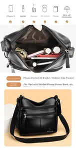 Detail view of large capacity black pebbled leather crossbody bag with triple zippers