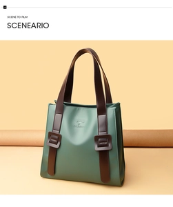 Detailed view of the dark green tote bag with premium leather texture and retro brown buckles