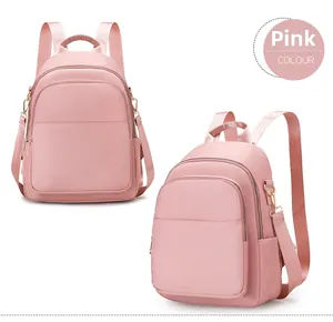 Sac à dos rose en nylon imperméable avec double fermeture éclair et bretelles réglables