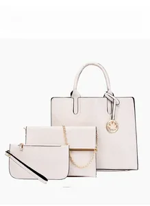 Detailed set of white quilted leather handbags with golden hardware and leaf pendant