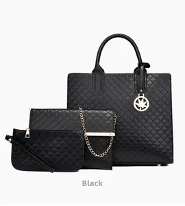 Detailed set of black quilted handbags with golden leaf pendant and chain straps