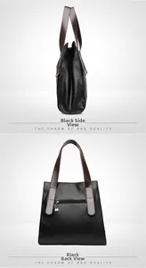 Detail of black pebbled leather tote bag with brown handles and a back zipper pocket