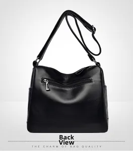 Back view of black litchi pattern leather bag showing functional zipper pocket and strap