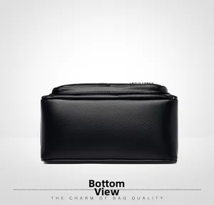 Detailed bottom view of black pebble leather tote showing sturdy stitching and texture