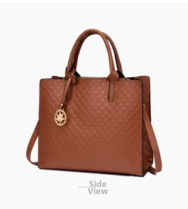 Brown quilted handbag with gold leaf pendant and shoulder strap in slight side view