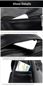 Detail view of black litchi pattern leather bag with multiple anti-theft zipper pockets