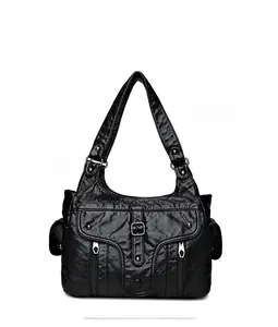 Front detail of black vintage shoulder bag with multiple pockets and silver hardware