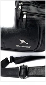 Detail of lychee pattern leather texture with silver hardware zipper and logo