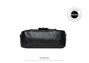 Close-up of the black lychee pattern leather bottom with precise stitching details