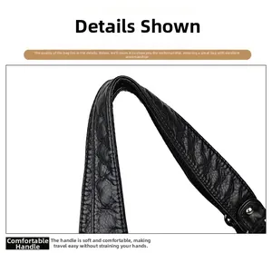 Detail of soft black leather handle with lychee texture and silver metal rivets