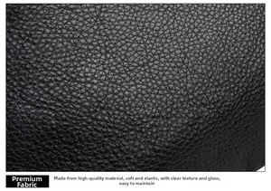 Detail of premium black lychee texture leather with soft elastic finish and clear grain