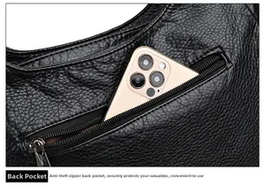 Detail of black pebbled leather handbag featuring a secure rear anti-theft zipper pocket