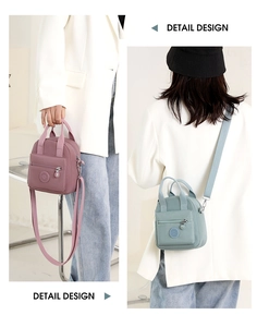 Detail design of mini nylon crossbody bags in lotus pink and light blue green colors