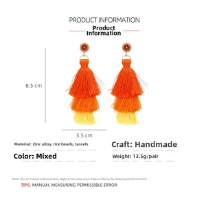 Detail view of handmade bohemian tassel earrings with seed beads and three-layer gradient