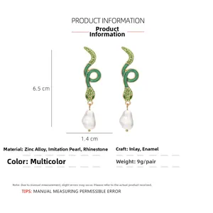 Detail view of green crystal snake earrings showing dimensions 6.5cm length and materials