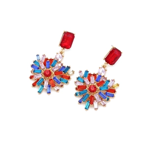 Detail of colorful geometric gemstone heart earrings with multi-colored crystals