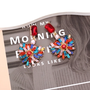 Chic gold earrings with colorful rhinestones in a vibrant heart shape sunburst design