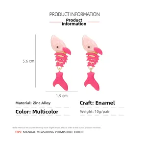 Detailed view of pink enamel fish bone earrings with gold hooks and size parameters