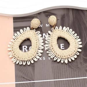 Bohemian handmade raffia teardrop earrings with radial fringe and woven stud details
