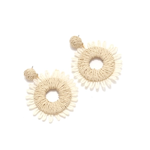 Handwoven raffia sunflower earrings in bohemian style with natural cream straw texture