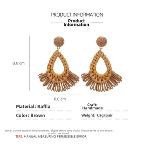Detail view of brown raffia teardrop earrings with dimensions 8.0cm height and 6.0cm width