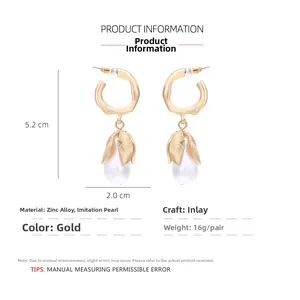 Detailed view of gold flower earrings with pearl drops showing 5.2cm length dimensions