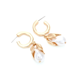 Elegant gold flower earrings with teardrop pearls and textured leaf details on white