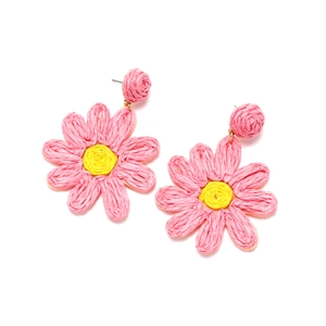 Handmade woven pink and yellow raffia flower earrings in a vibrant bohemian holiday style