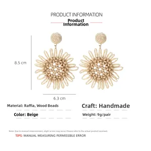 Bohemian beige raffia flower earrings measuring 8.5cm by 6.3cm with wood bead details