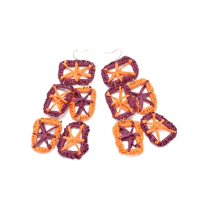 Bohemian oversized hand-woven raffia earrings in bold orange and purple contrast geometry