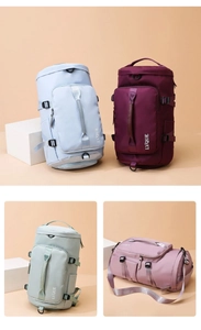 Detail of multi-compartment travel bags in pastel colors with removable shoulder straps